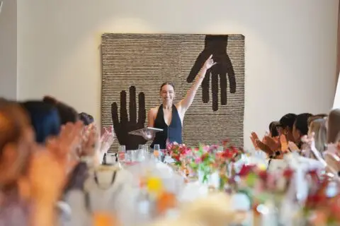 Ariel, owner of Bloom Sugaring, giving her speech at Bad Bitch Breakfast